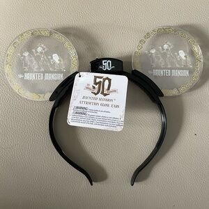 Disney park haunted mansion attraction glow ears